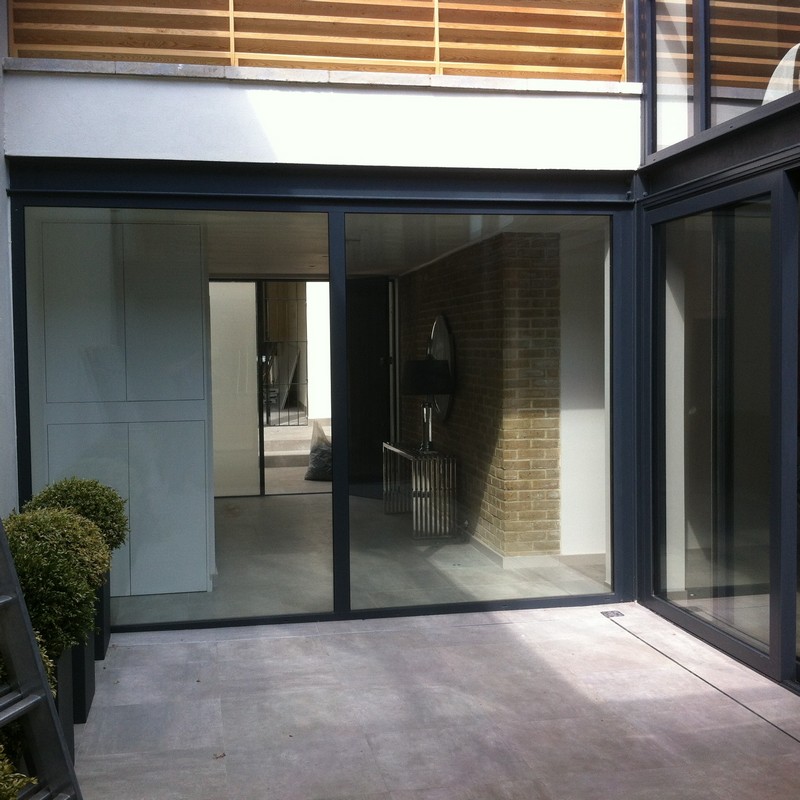 Floor-to-ceiling sliding doors opening to courtyard in Clerkenwell