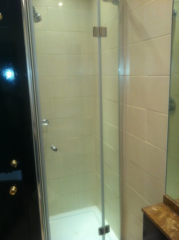Frameless glass shower enclosure with chrome fittings in Clerkenwell