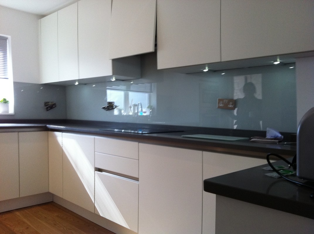 Grey glass kitchen splashback with LED lighting in Clerkenwell