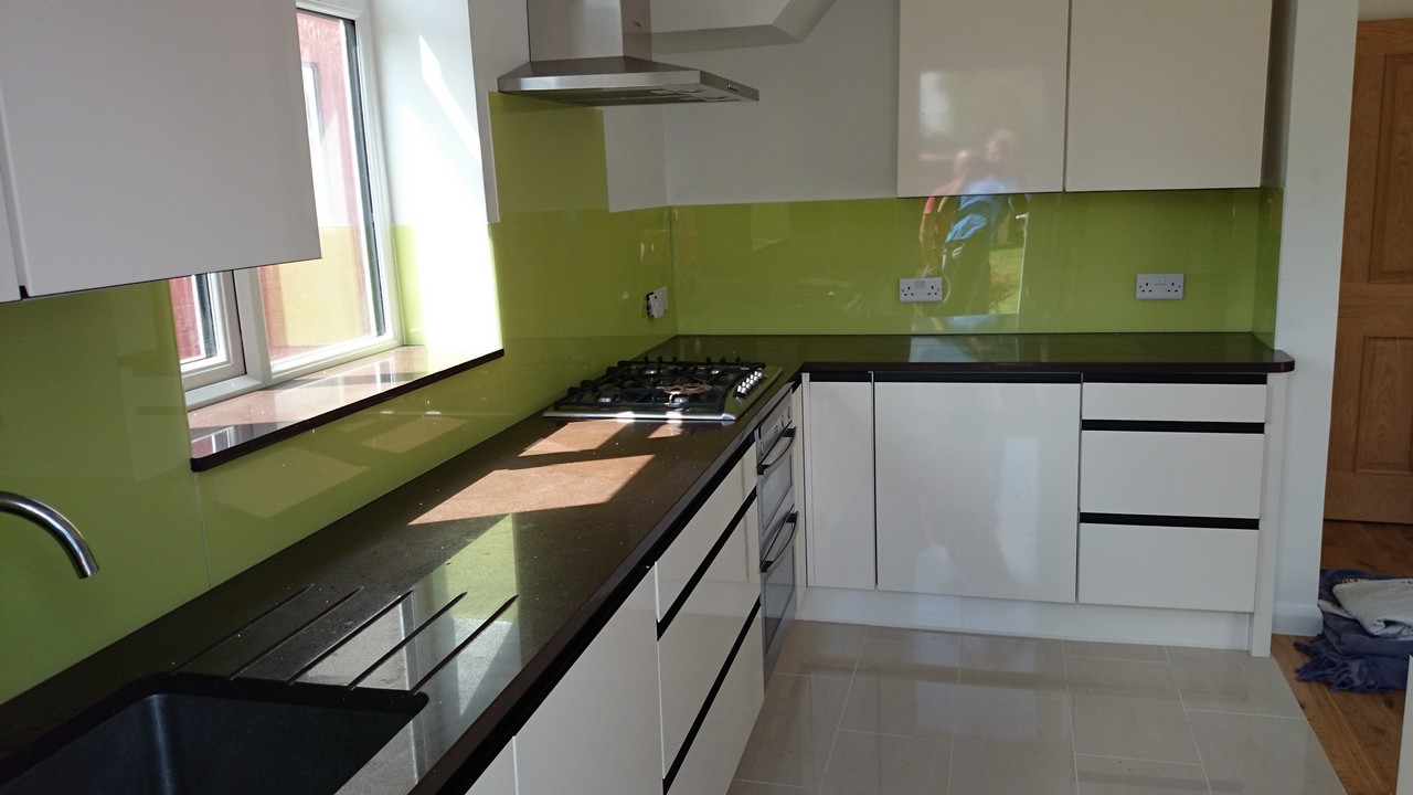 Lime green glass kitchen splashback installed by Clerkenwell glaziers