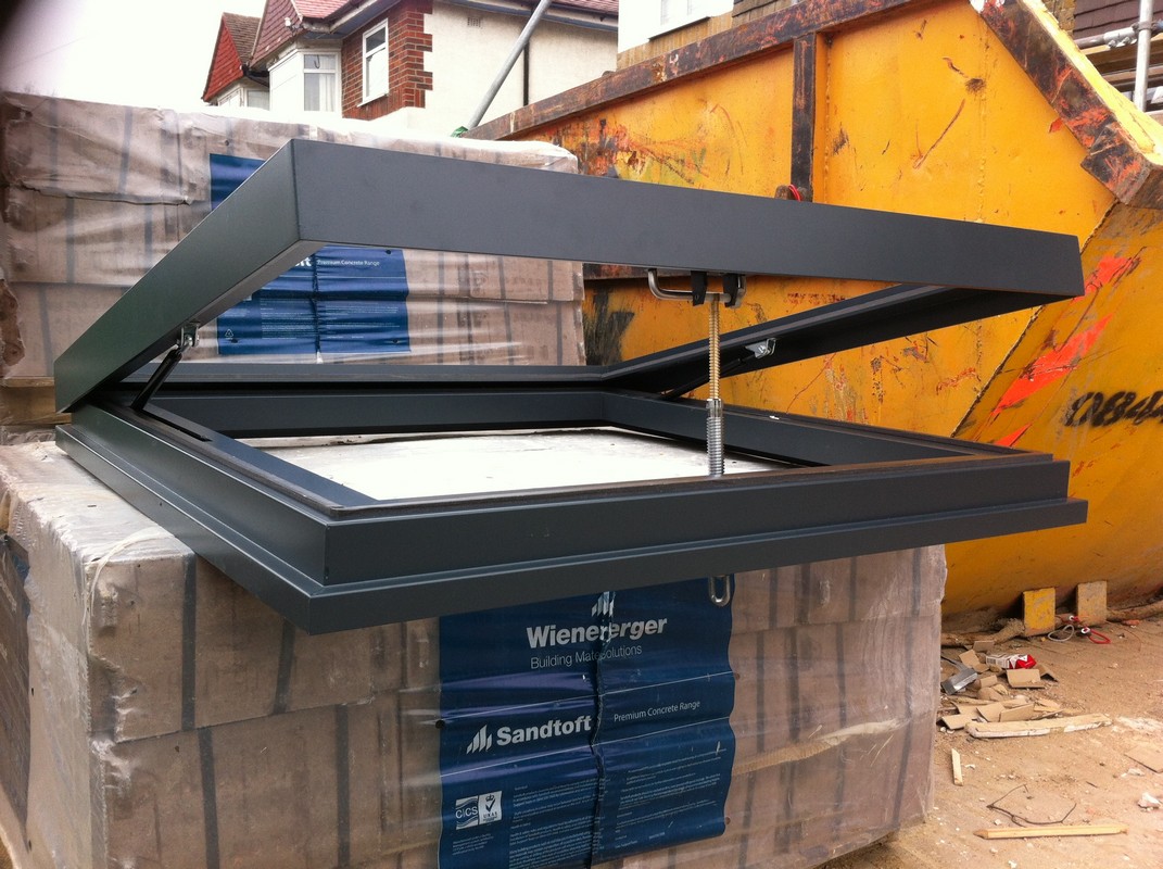 Opening flat roof skylight in anthracite grey installed in Clerkenwell